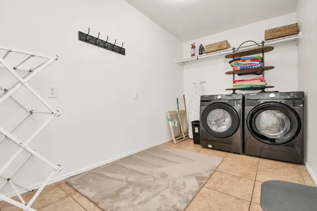 a utility room with dryer and washer