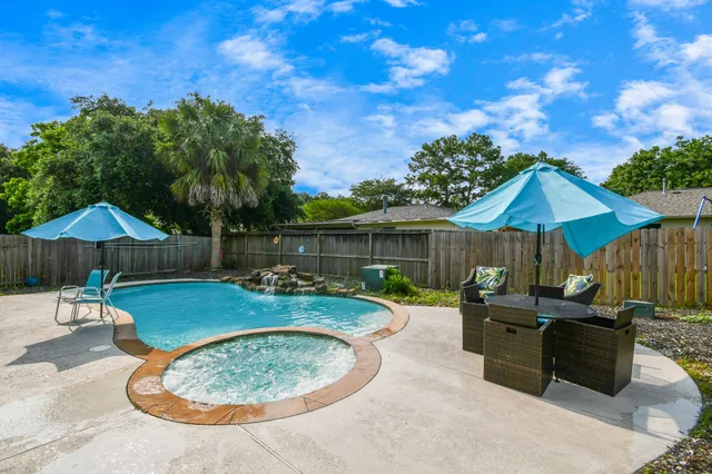 a patio with a table and chairs