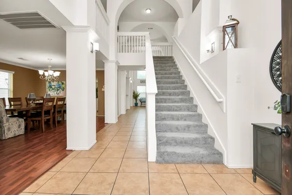 a view of entryway and hall with dining room