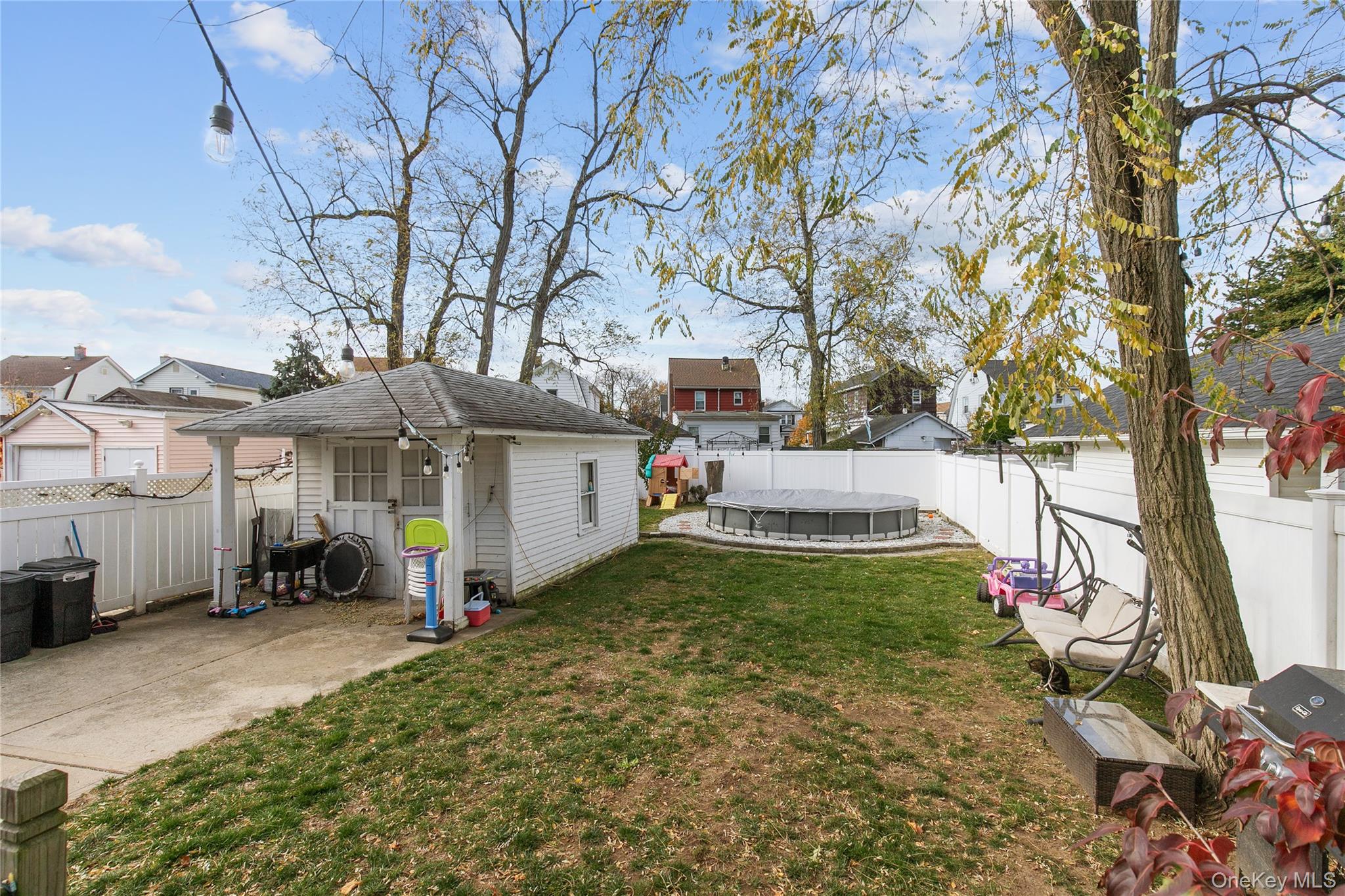 34 Avondale Street Valley Stream, NY 11581 - Photo 19 of 20 a view of a house with backyard and a tree