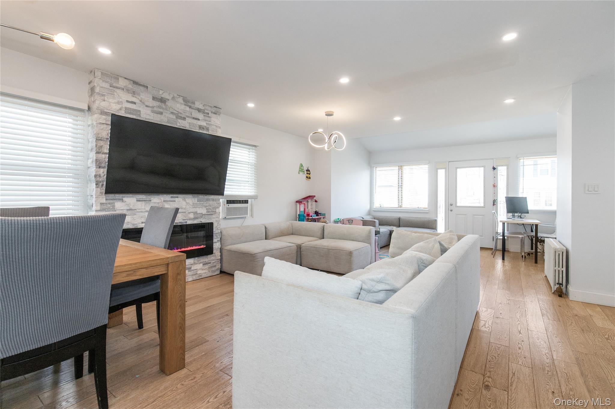 34 Avondale Street Valley Stream, NY 11581 - Photo 5 of 20 a living room with furniture and a flat screen tv