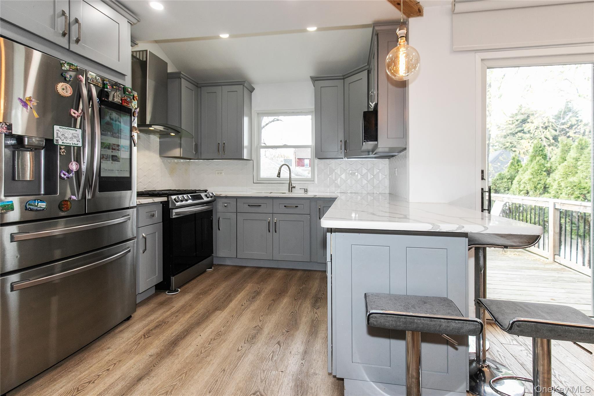 34 Avondale Street Valley Stream, NY 11581 - Photo 8 of 20 a kitchen with a sink appliances and cabinets