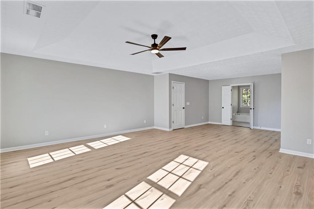 4061 Jewel Terrace Conley, GA 30288 - Photo 21 of 36 wooden floor in an empty room with a window