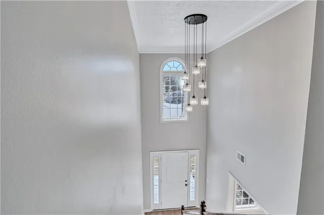 a view of a hallway with windows