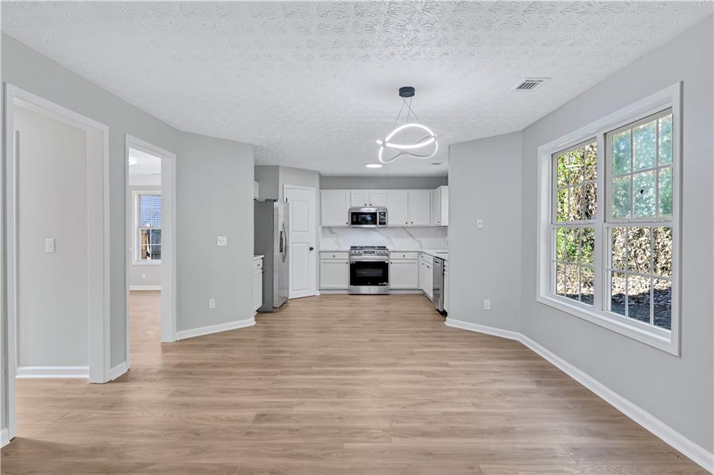 4061 Jewel Terrace Conley, GA 30288 - Photo 10 of 36 a view of a kitchen with a sink and a window