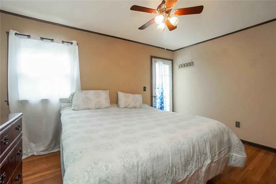 3031 Shakespeare Road Bethlehem, PA 18017 - Photo 16 of 30 Hardwood flooring and a ceiling fan create a comfortable and functional sleeping environment. Picture has been digitally enhanced.