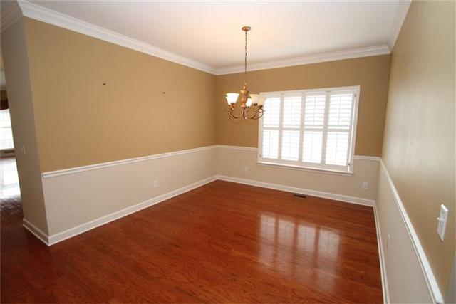 1429 Decatur Circle Franklin, TN 37067 - Photo 7 of 18 DINING ROOM WITH HARDWOOD FLOORS AND WAINSCOATING TRIM