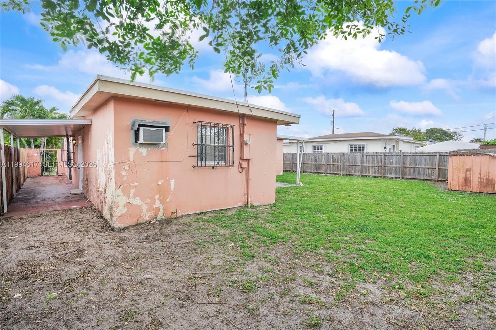 6810 Southwest 1st Street Miami, FL 33144 - Photo 12 of 17 a view of a house with backyard and a tree