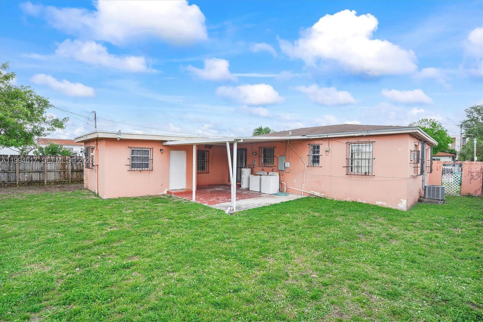 6810 Southwest 1st Street Miami, FL 33144 - Photo 13 of 17 front view of a house with a yard