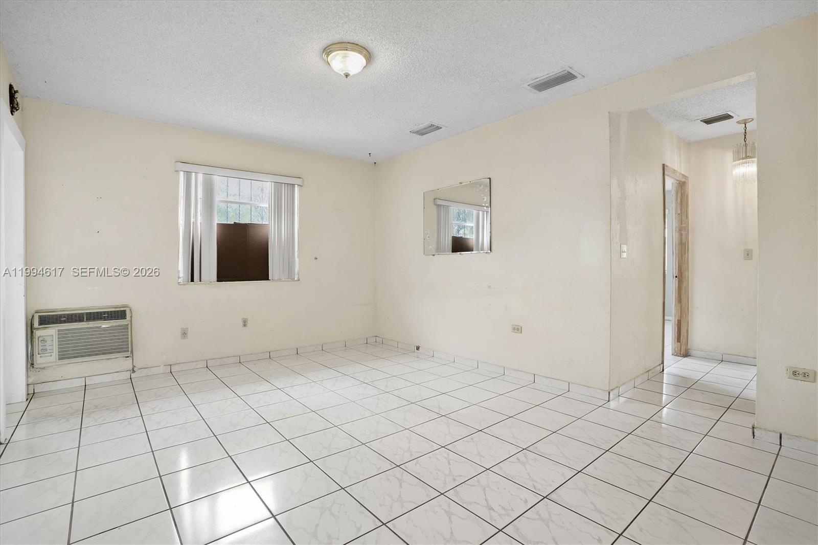 6810 Southwest 1st Street Miami, FL 33144 - Photo 2 of 17 a view of an empty room and window