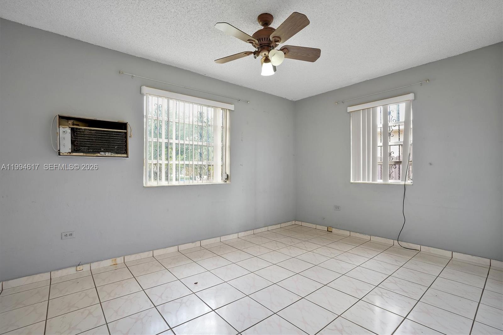 6810 Southwest 1st Street Miami, FL 33144 - Photo 4 of 17 a view of an empty room with a window