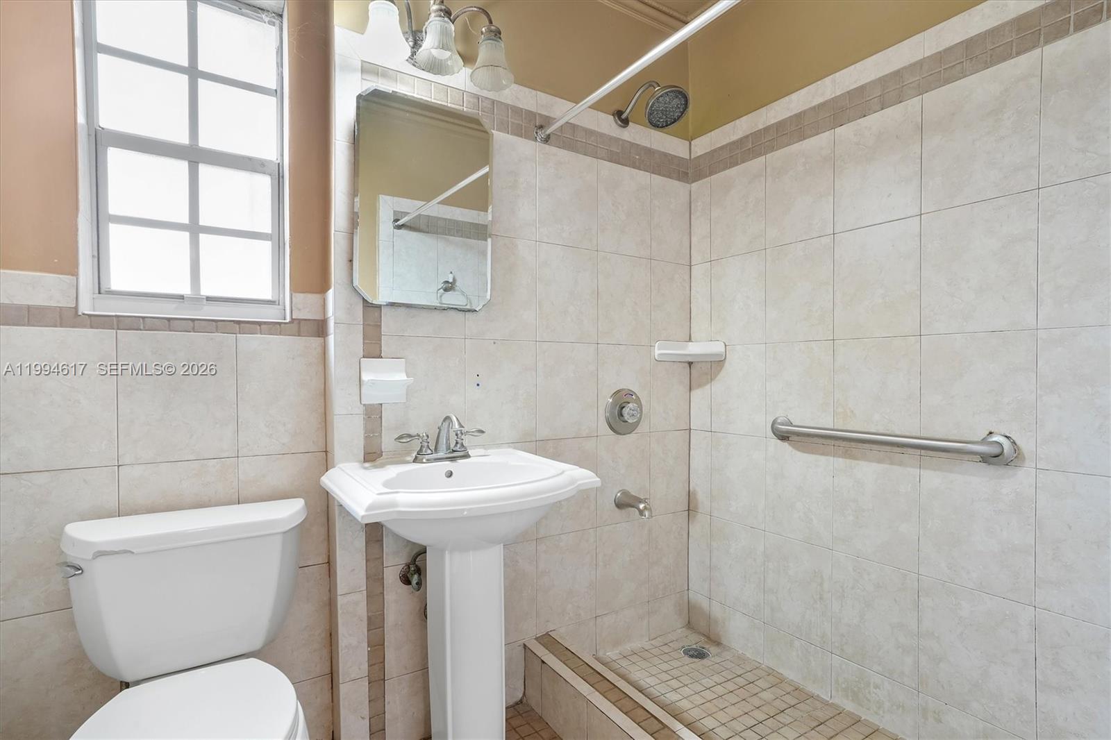 6810 Southwest 1st Street Miami, FL 33144 - Photo 6 of 17 a bathroom with a sink toilet and shower