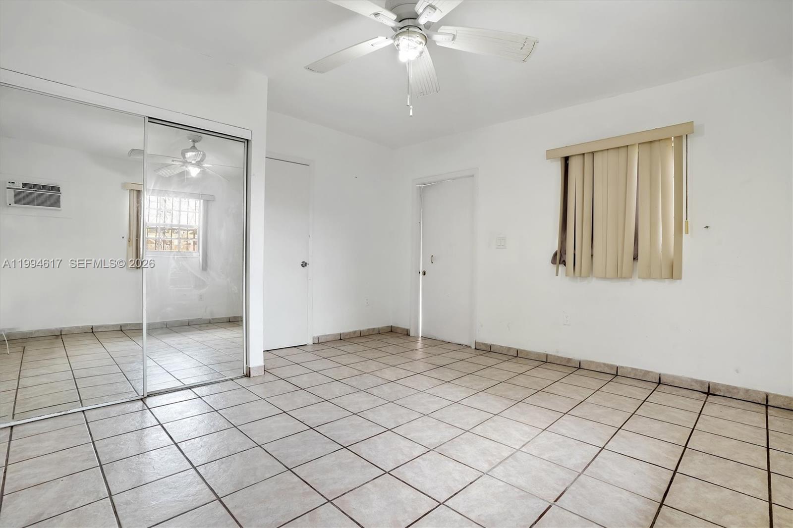 6810 Southwest 1st Street Miami, FL 33144 - Photo 8 of 17 a view of an empty room and window