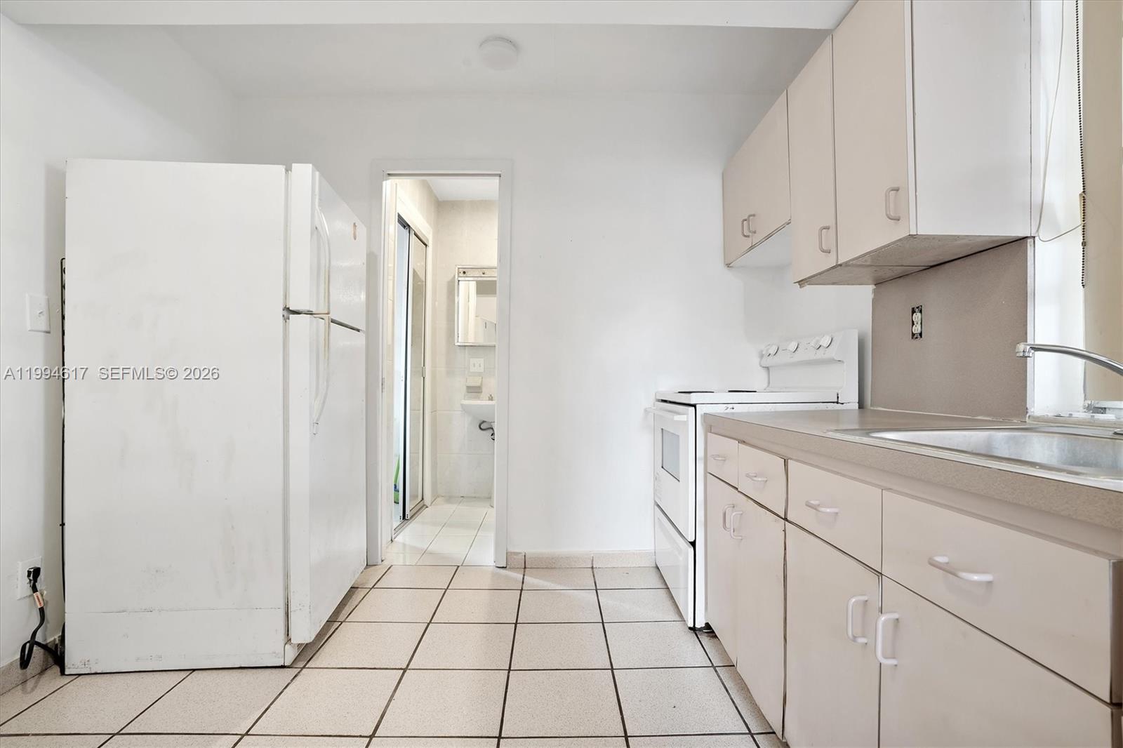 6810 Southwest 1st Street Miami, FL 33144 - Photo 10 of 17 a bathroom with a sink a toilet and shower