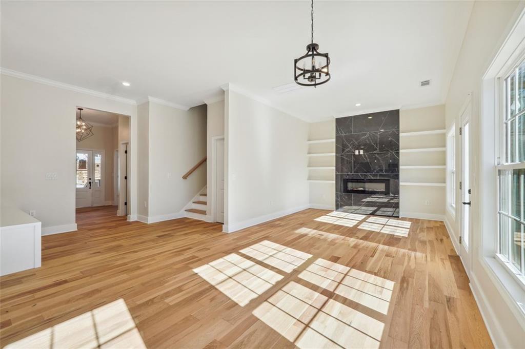 1620 Derry Avenue Southwest Atlanta, GA 30310 - Photo 19 of 47 a bedroom with a bed and a chandelier