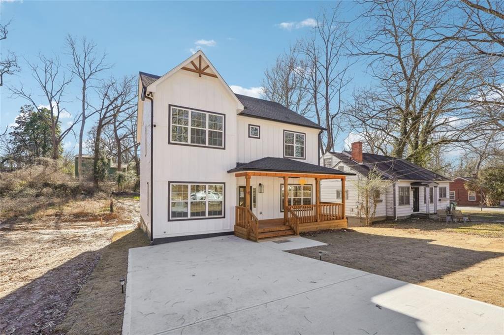 1620 Derry Avenue Southwest Atlanta, GA 30310 - Photo 2 of 47 a front view of a house with a yard and garage