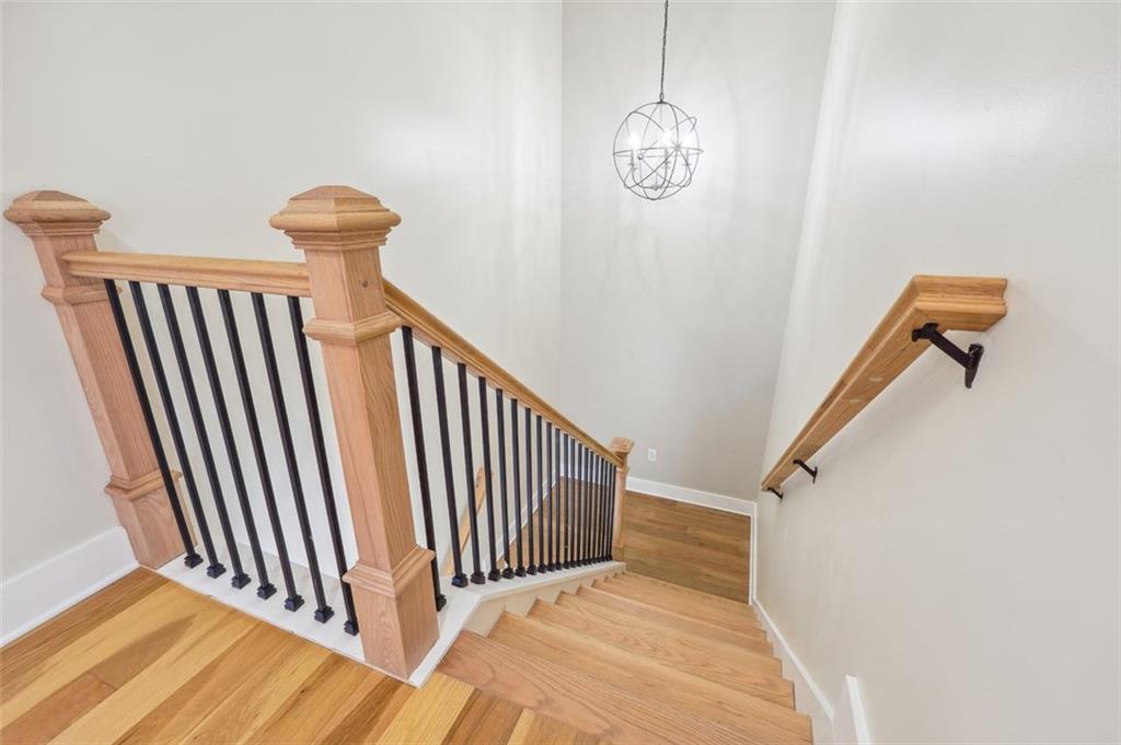1620 Derry Avenue Southwest Atlanta, GA 30310 - Photo 26 of 47 a view of staircase with railing and a chandelier