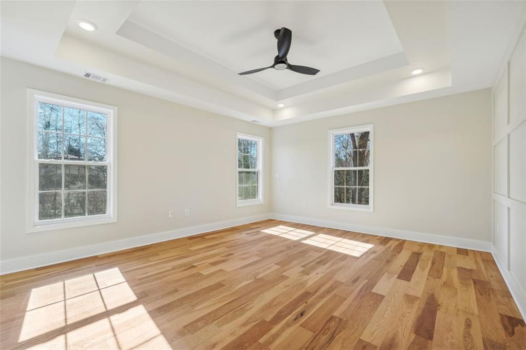 1620 Derry Avenue Southwest Atlanta, GA 30310 - Photo 27 of 47 a view of an empty room with a window and wooden floor