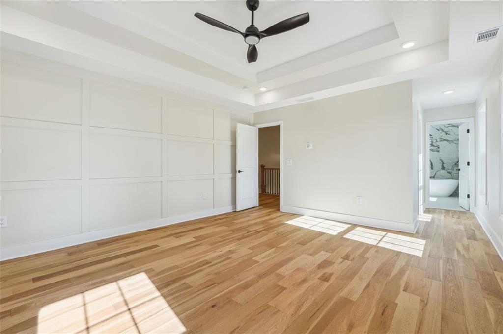 1620 Derry Avenue Southwest Atlanta, GA 30310 - Photo 28 of 47 a view of a livingroom with wooden floor and a ceiling fan