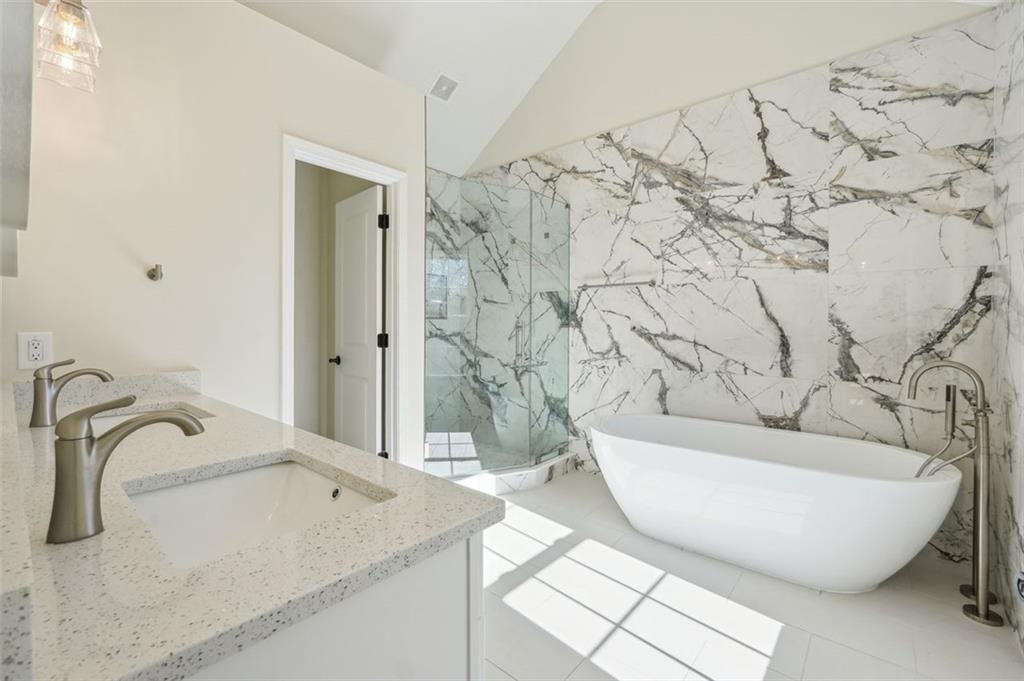 1620 Derry Avenue Southwest Atlanta, GA 30310 - Photo 29 of 47 a spacious bathroom with a bathtub and shower