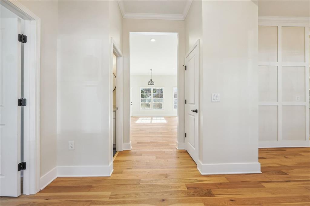 1620 Derry Avenue Southwest Atlanta, GA 30310 - Photo 5 of 47 a view of a hallway with wooden floor and a bathroom