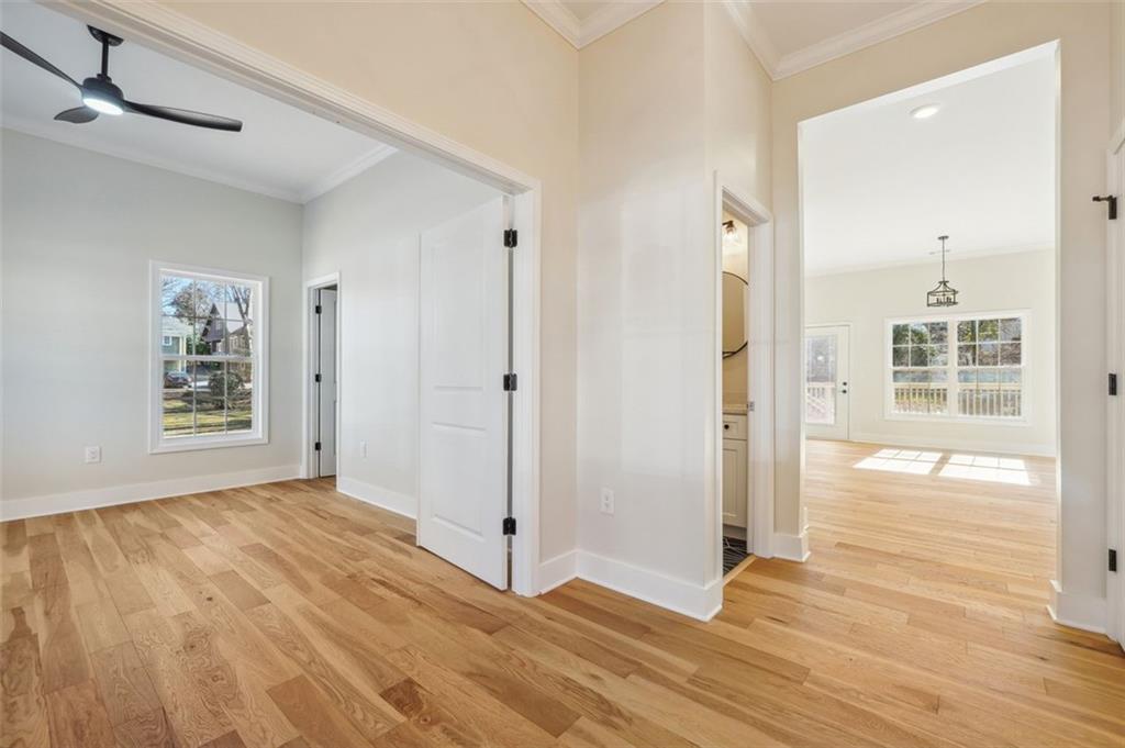 1620 Derry Avenue Southwest Atlanta, GA 30310 - Photo 6 of 47 a view of an empty room with wooden floor and a window