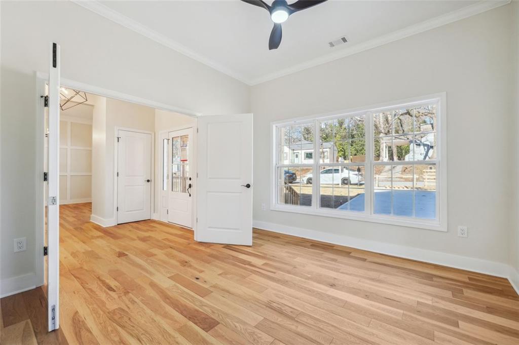 1620 Derry Avenue Southwest Atlanta, GA 30310 - Photo 8 of 47 wooden floor in an empty room with a window