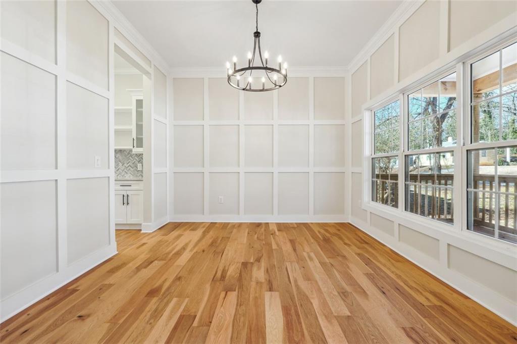 1620 Derry Avenue Southwest Atlanta, GA 30310 - Photo 9 of 47 a view of empty room with wooden floor and fan