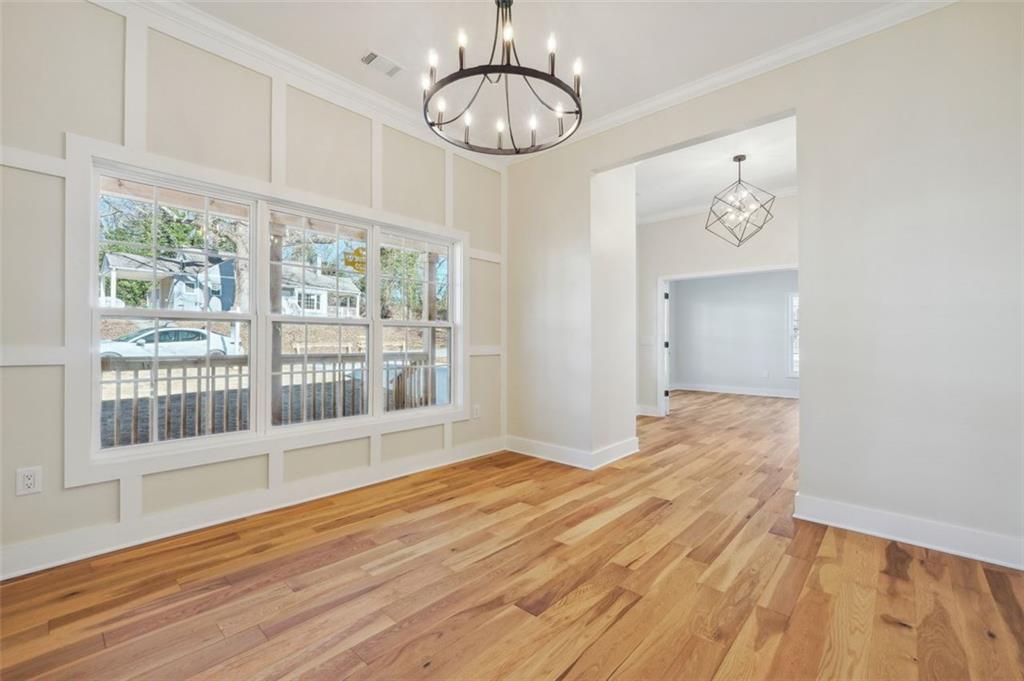 1620 Derry Avenue Southwest Atlanta, GA 30310 - Photo 10 of 47 a view of empty room with wooden floor and fan