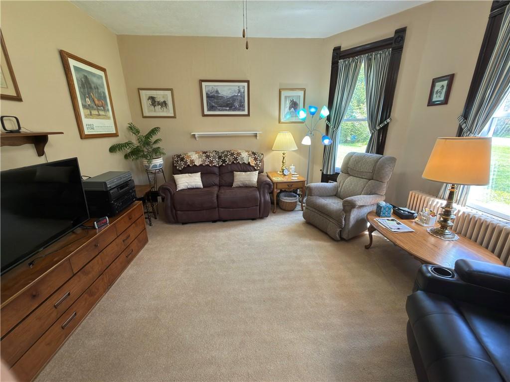 122 Coal Bank Road Greenville, PA 16125 - Photo 34 of 50 a living room with furniture and a flat screen tv