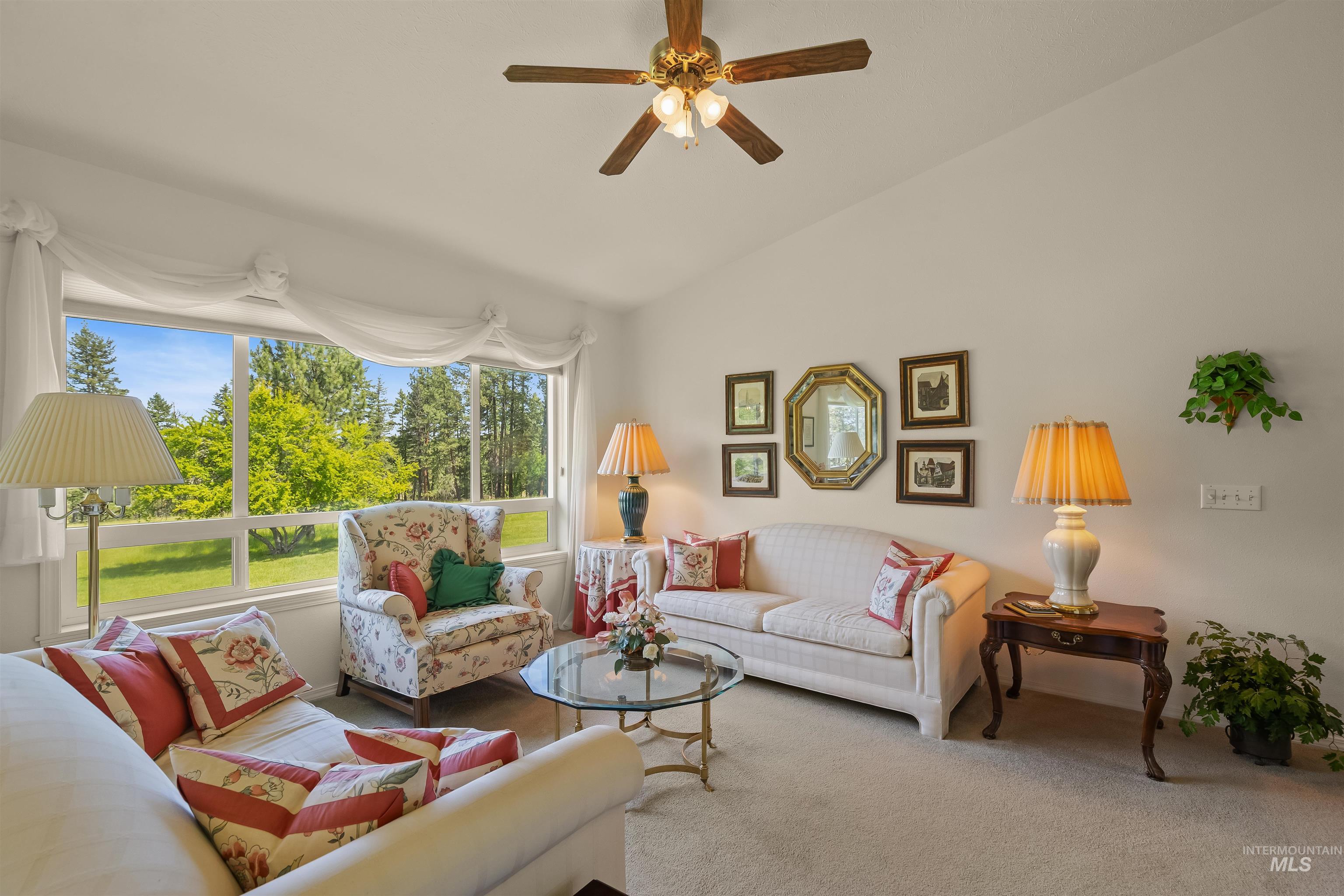 743 Wall Crk Road Stites, ID 83552 - Photo 20 of 48 Spacious living area featuring a vaulted ceiling and a ceiling fan
