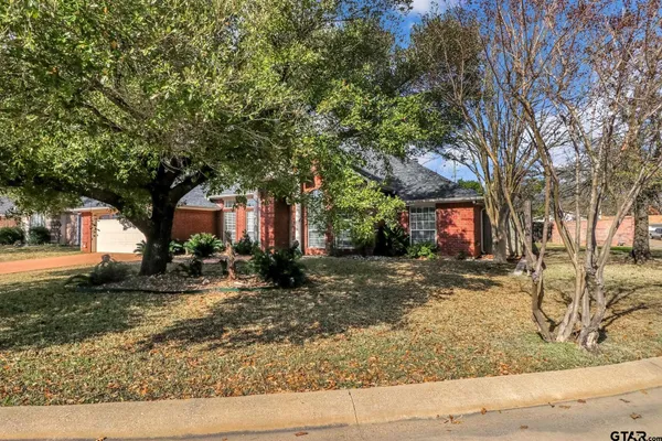 a view of a trees in front of a house