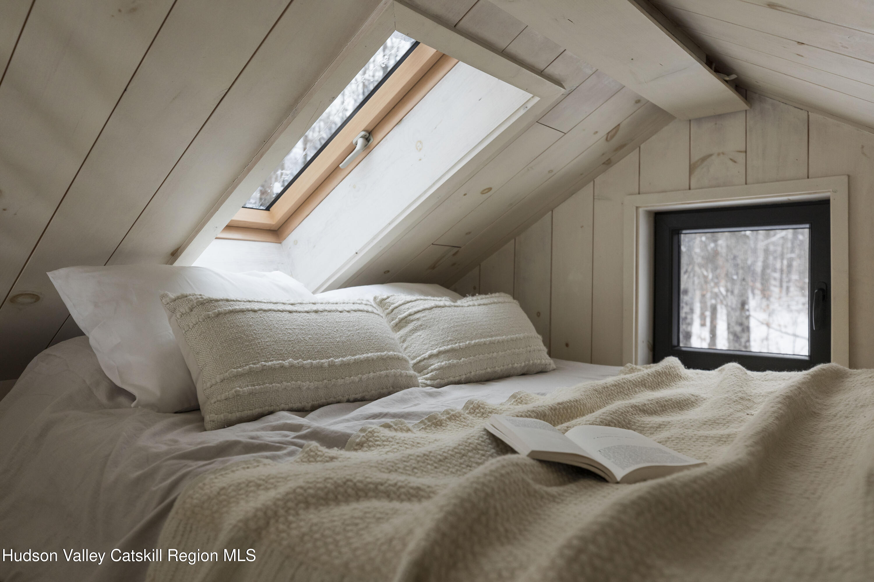 692 Blenheim Hill Road Jefferson, NY 12093 - Photo 10 of 21 a bed sitting in a bedroom next to a window