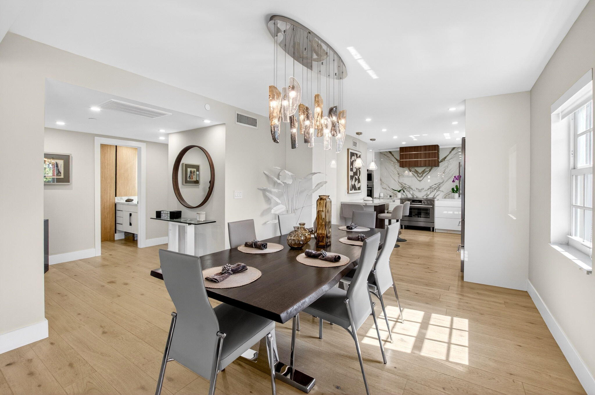 950 De Soto Road, Unit 5A Boca Raton, FL 33432 - Photo 17 of 98 a view of a dining room with furniture and a chandelier