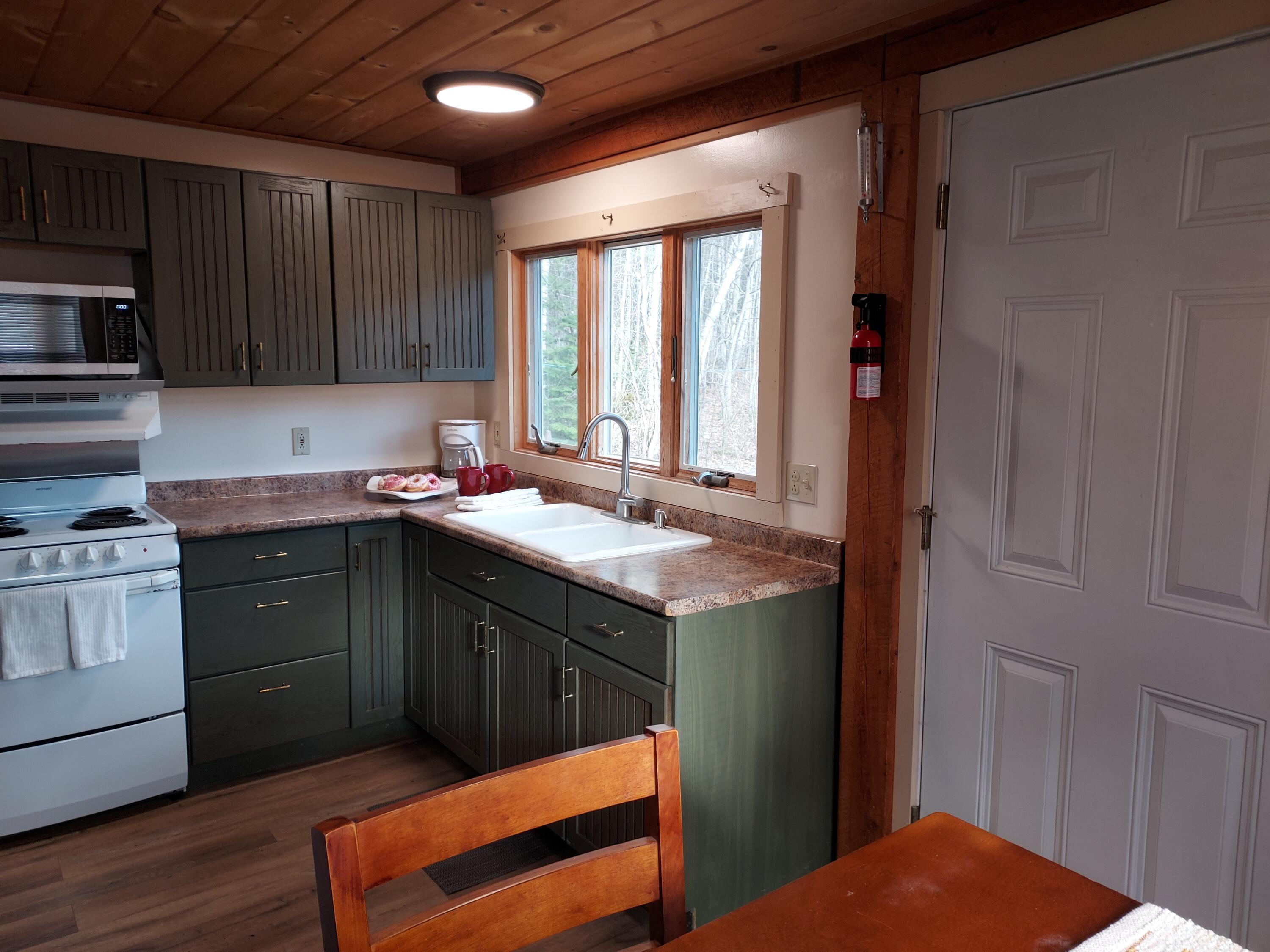 61 Floyd French Road Athens, ME 04912 - Photo 19 of 33 Kitchen with Door to Side Deck