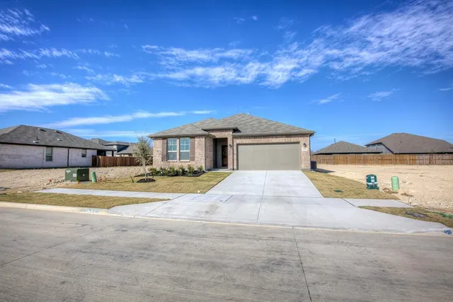 a view of a house with a flat screen tv and outdoor space