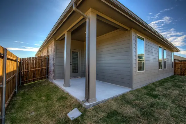 a house view with a backyard space
