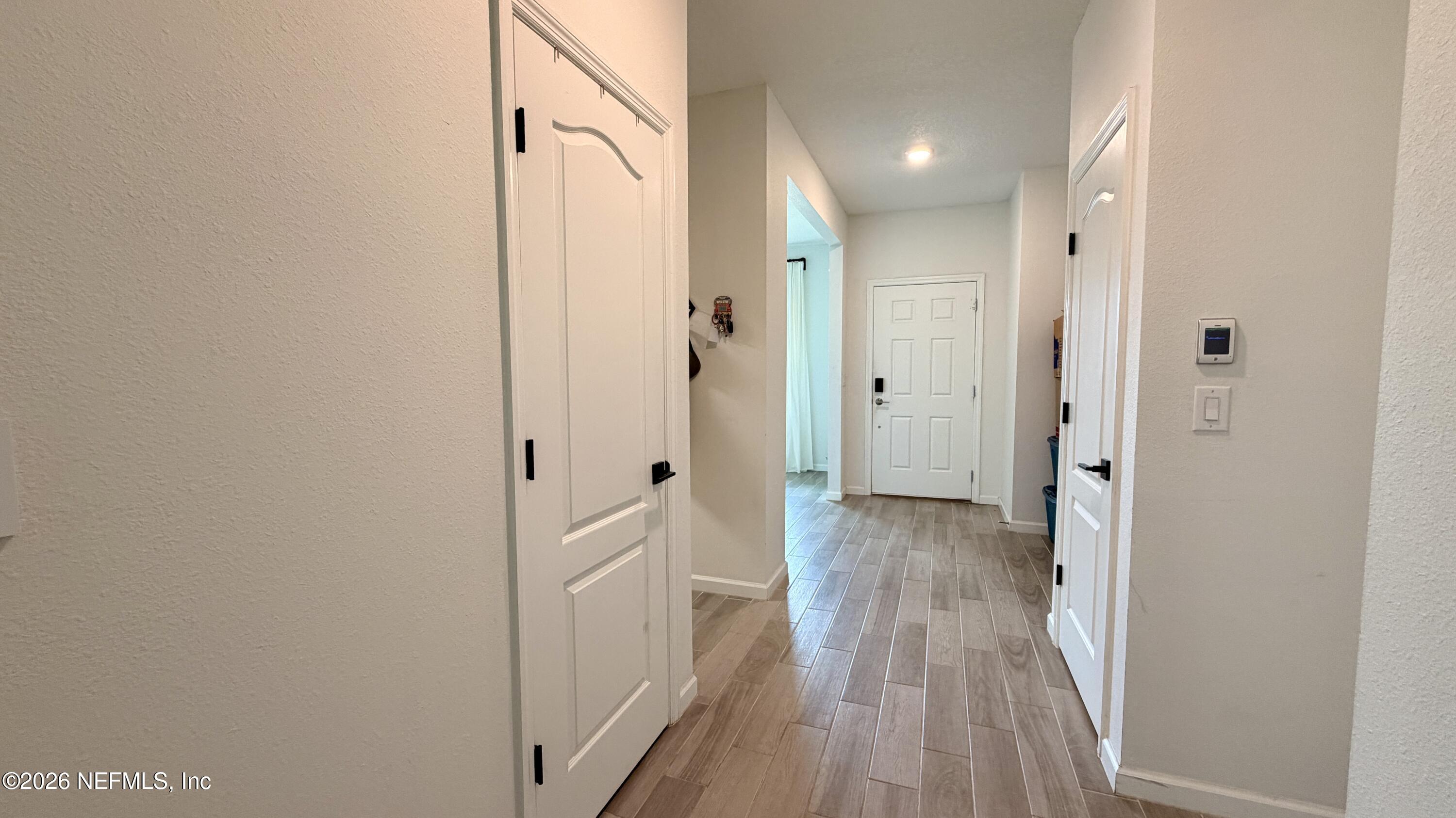 37 Saba Lane St. Augustine, FL 32092 - Photo 11 of 42 a view of a hallway with wooden floor and staircase