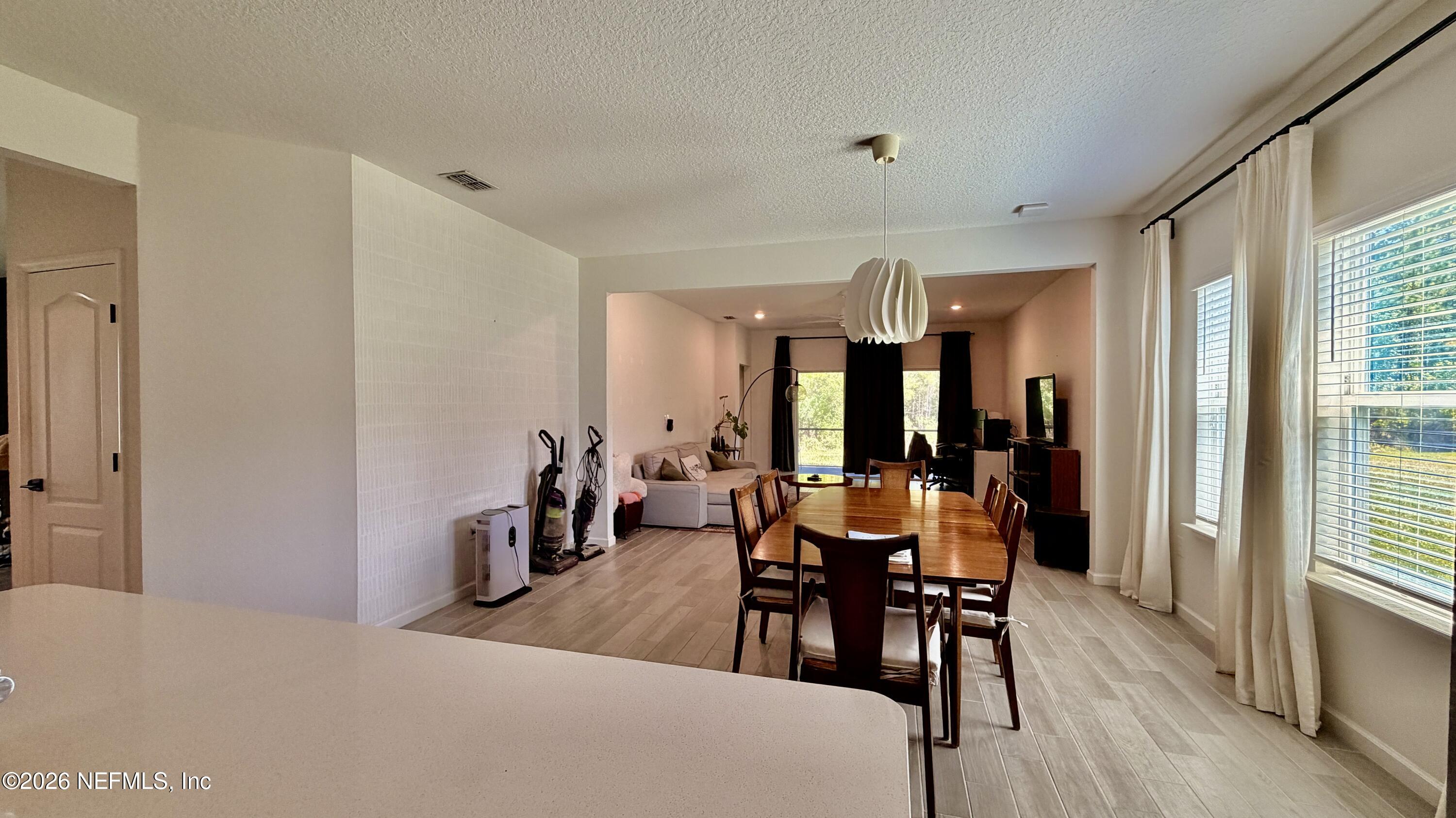 37 Saba Lane St. Augustine, FL 32092 - Photo 18 of 42 a view of a dining room with furniture window and wooden floor