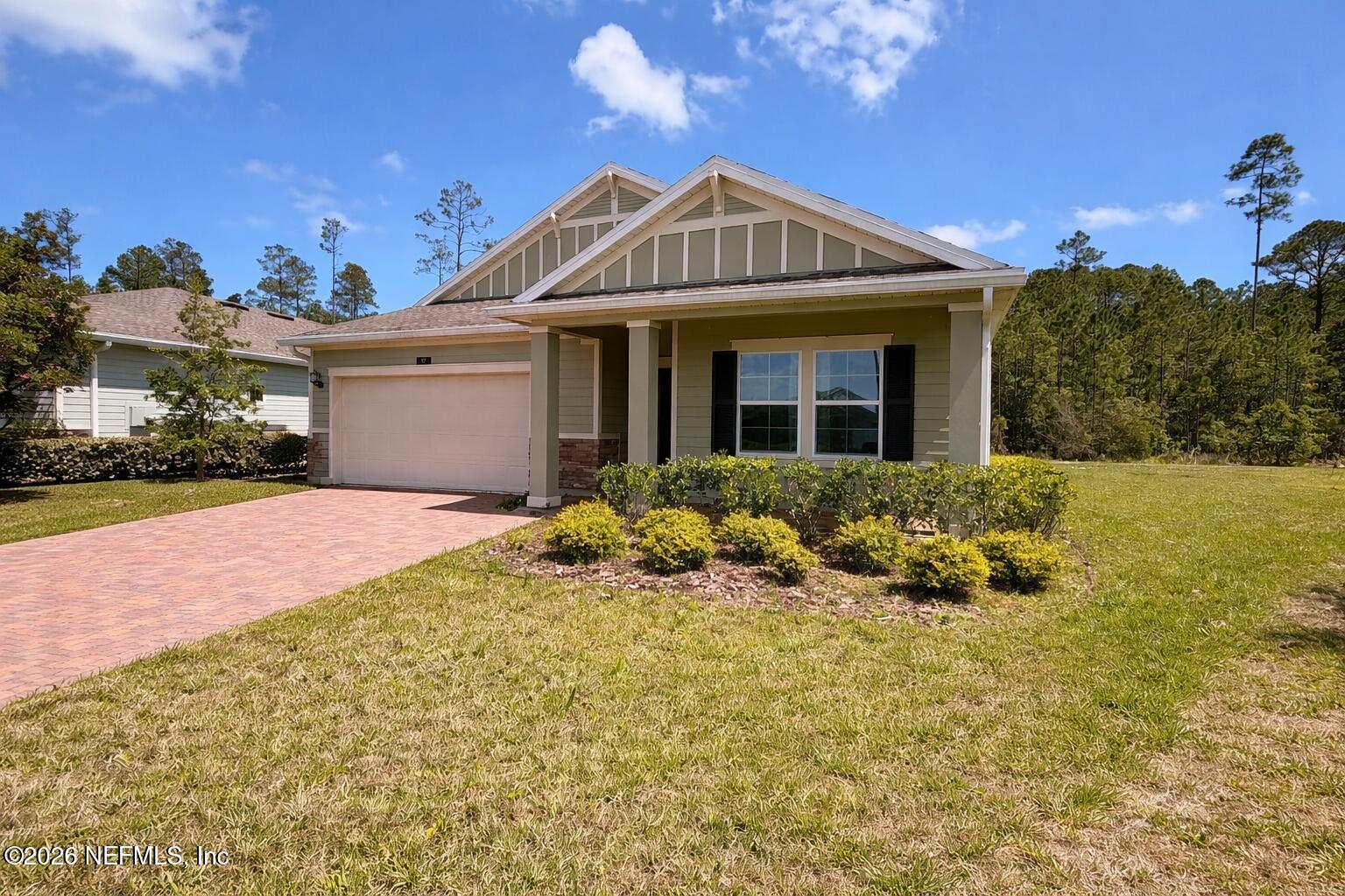 37 Saba Lane St. Augustine, FL 32092 - Photo 2 of 42 a front view of a house with a yard