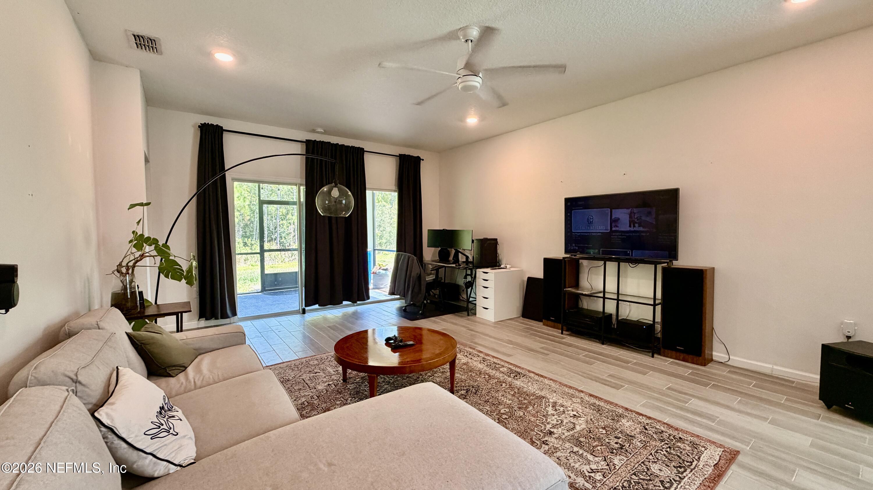 37 Saba Lane St. Augustine, FL 32092 - Photo 22 of 42 a living room with furniture and a flat screen tv