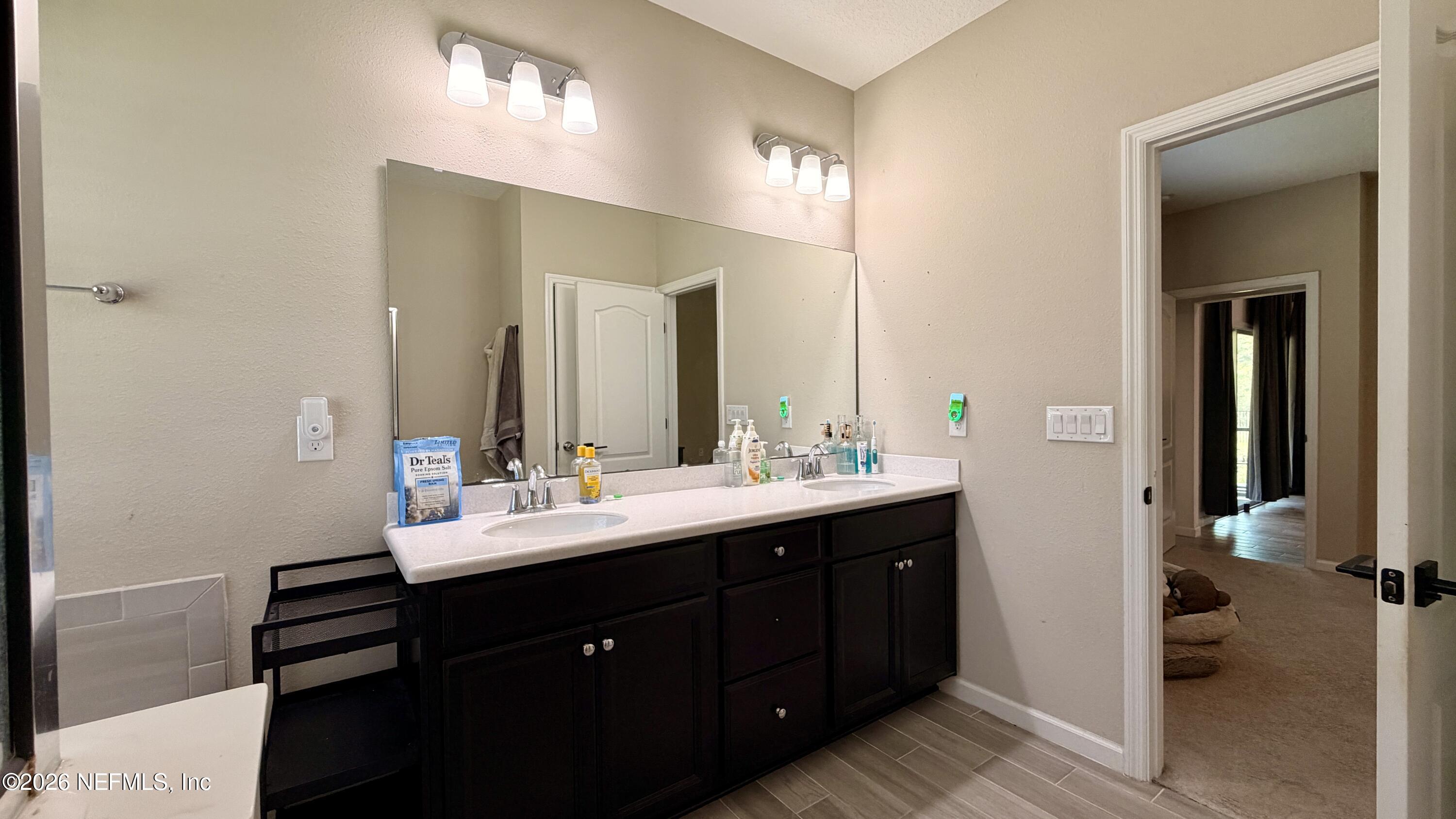 37 Saba Lane St. Augustine, FL 32092 - Photo 30 of 42 a bathroom with a double vanity sink and mirror