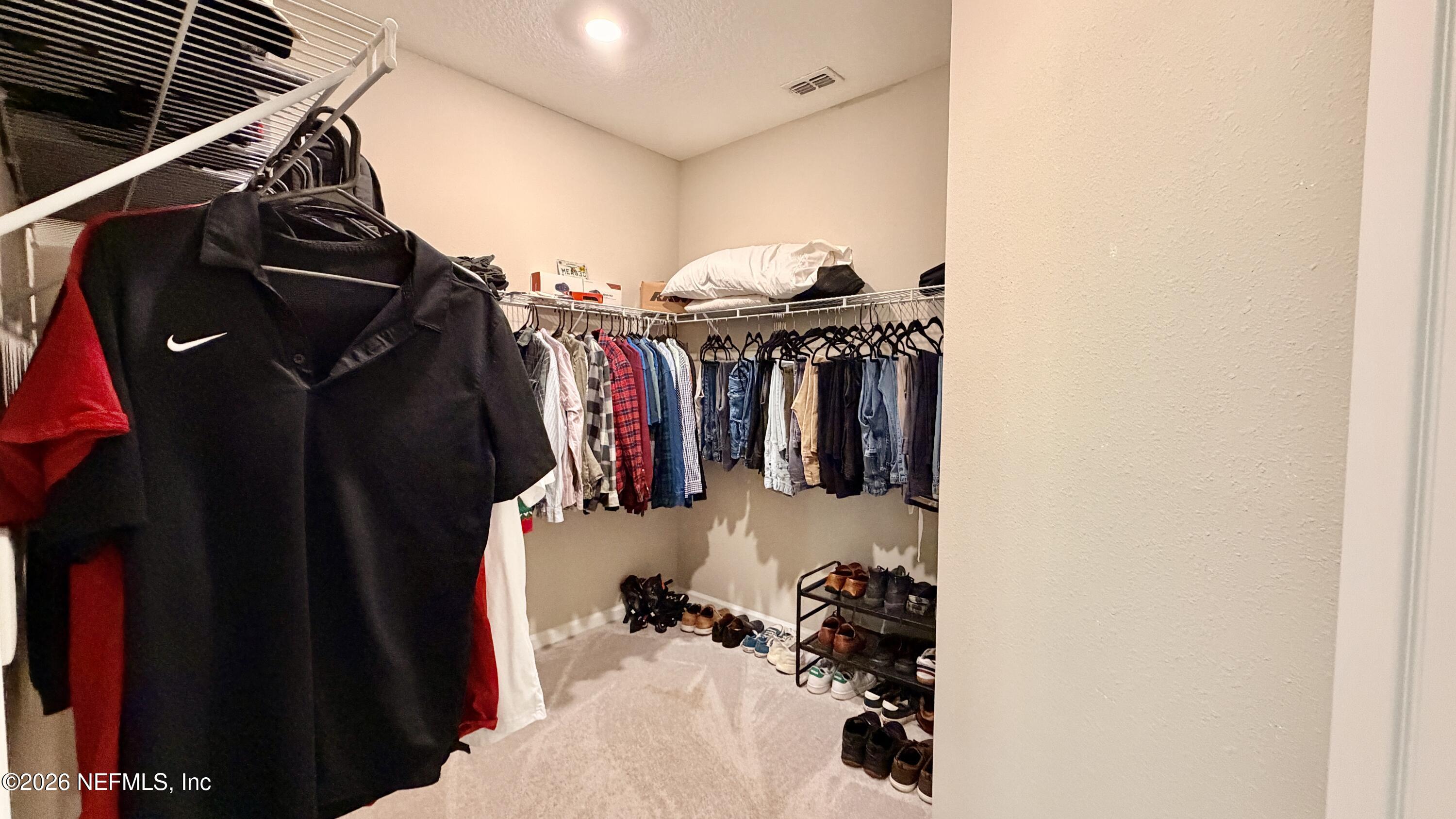 37 Saba Lane St. Augustine, FL 32092 - Photo 31 of 42 a view of walk in closet with clothes and shoes