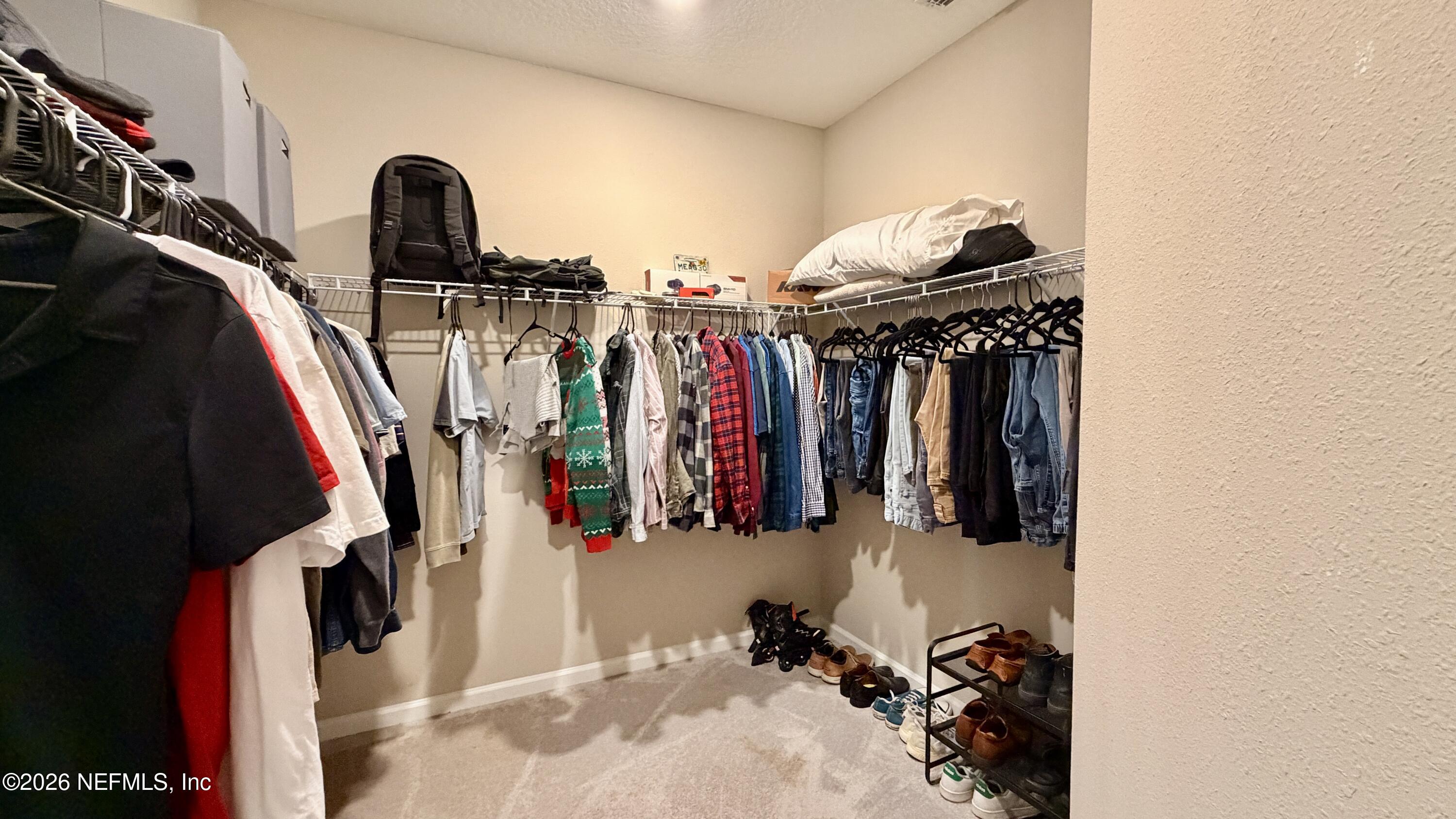 37 Saba Lane St. Augustine, FL 32092 - Photo 32 of 42 a view of walk in closet with clothes and shoes