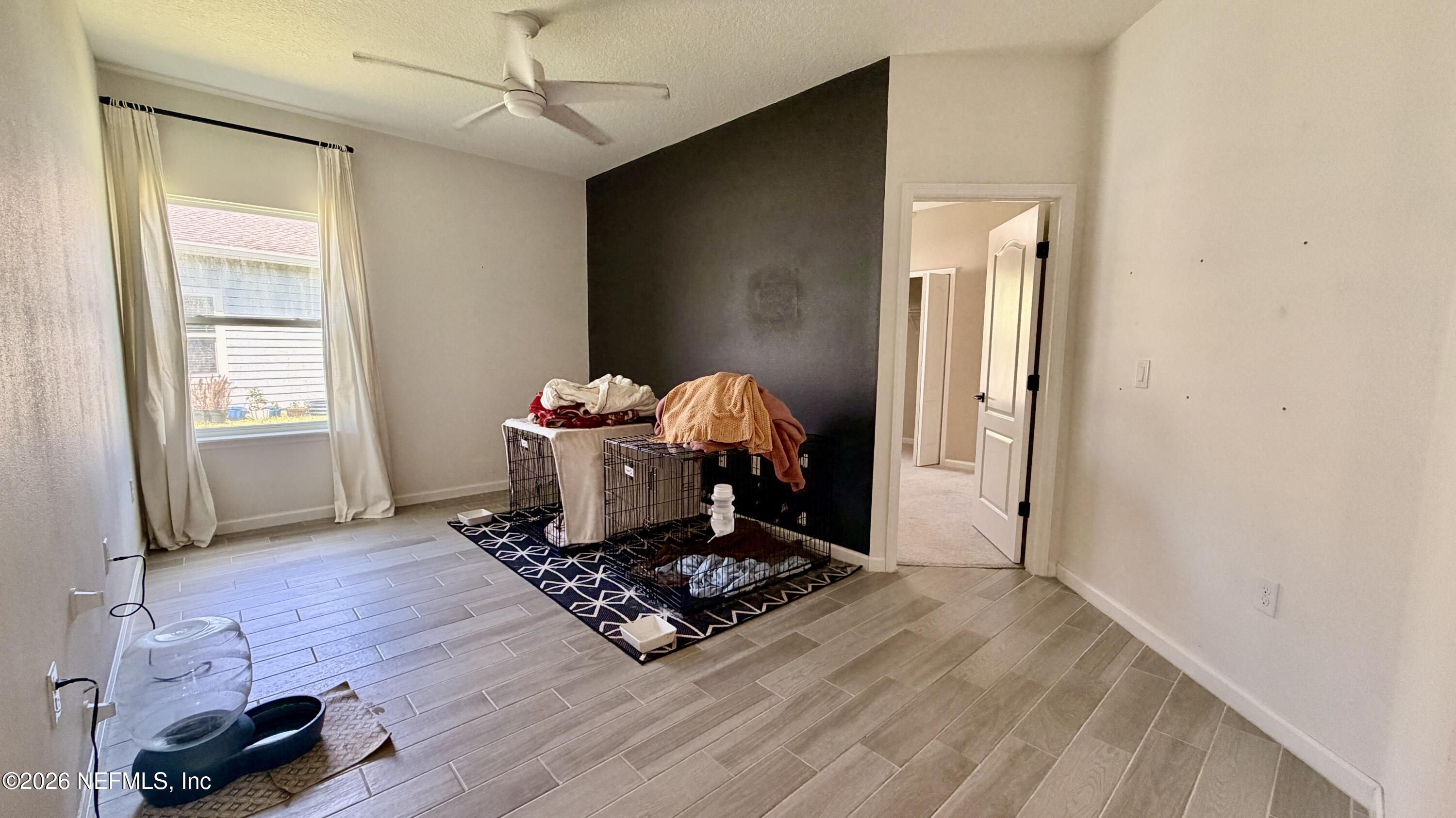37 Saba Lane St. Augustine, FL 32092 - Photo 33 of 42 a living room with furniture and a flat screen tv