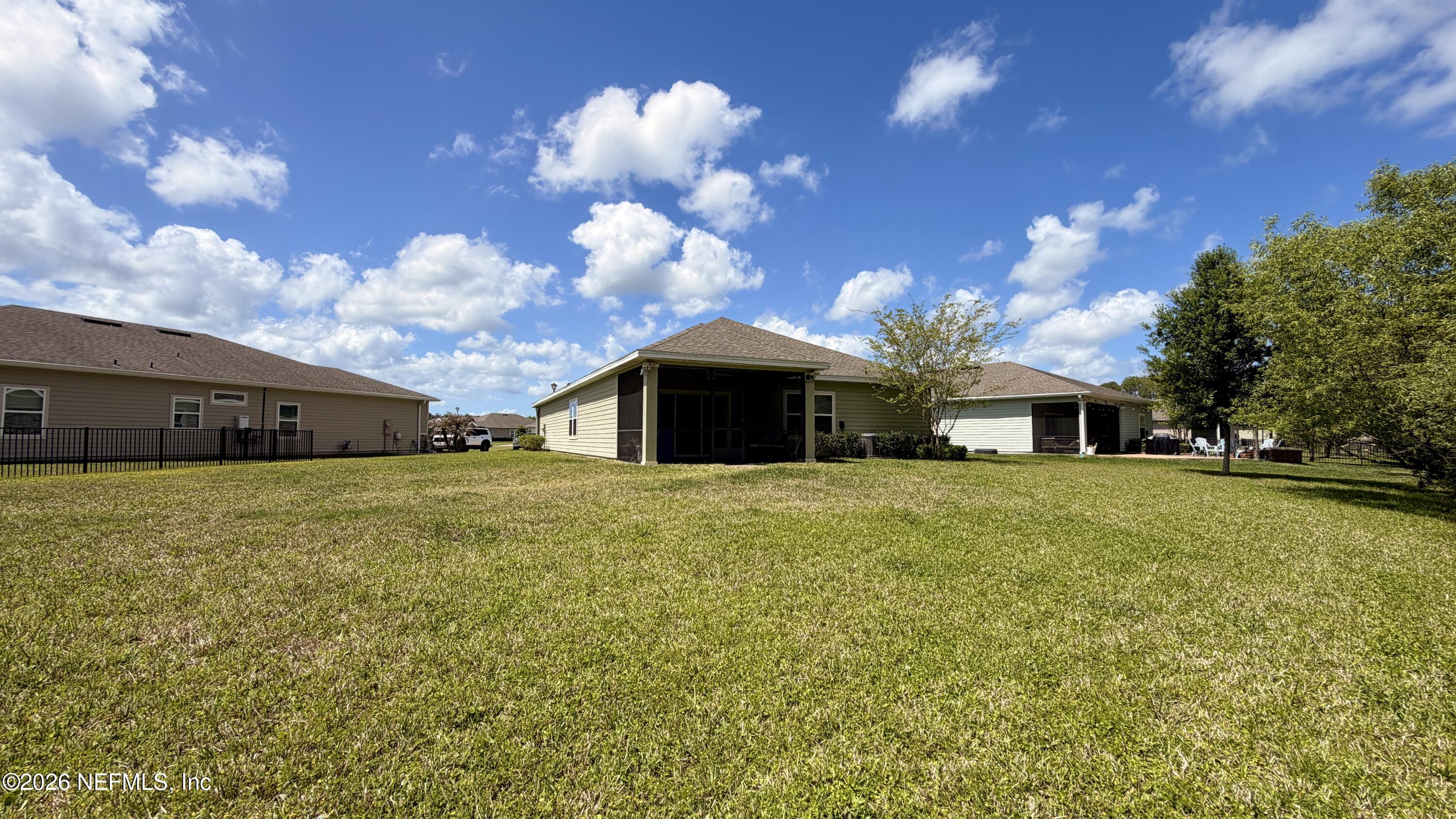 37 Saba Lane St. Augustine, FL 32092 - Photo 4 of 42 a front view of a house with a yard and garage