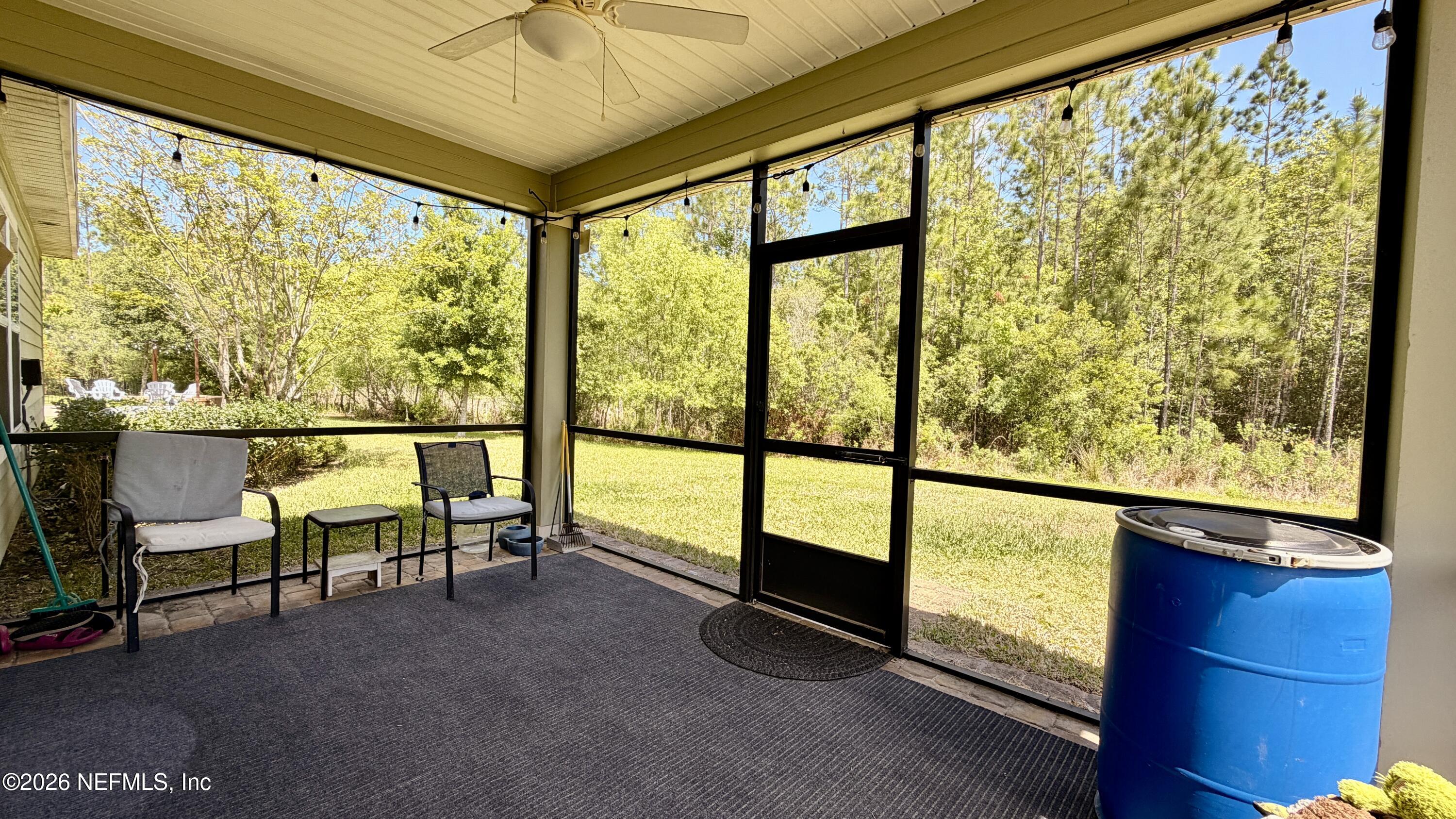 37 Saba Lane St. Augustine, FL 32092 - Photo 41 of 42 a view of a porch with furniture and a window