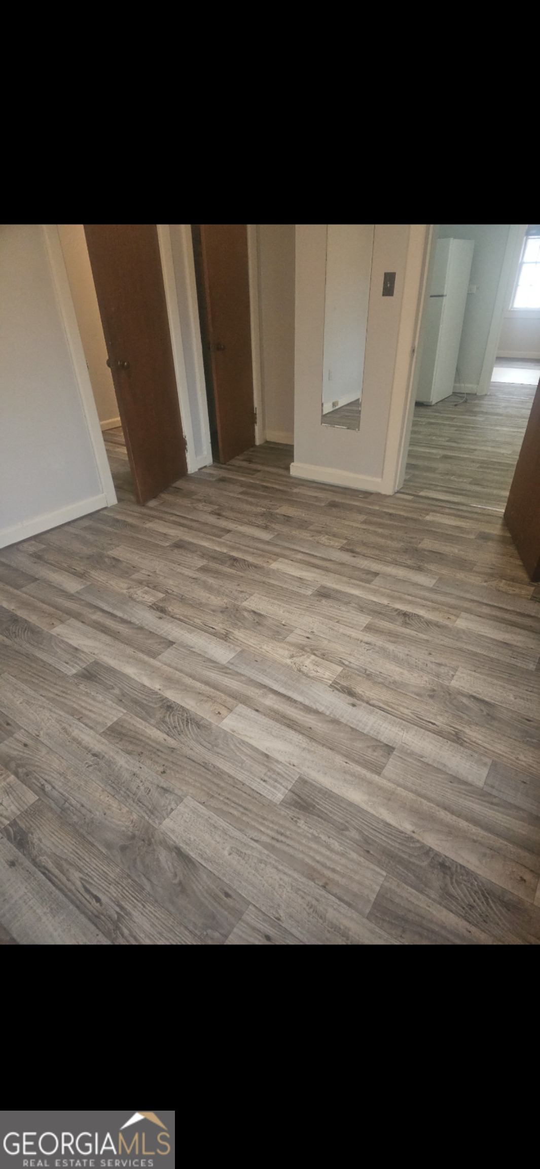 342 East Allen Street Baxley, GA 31513 - Photo 3 of 9 a view of wooden floor