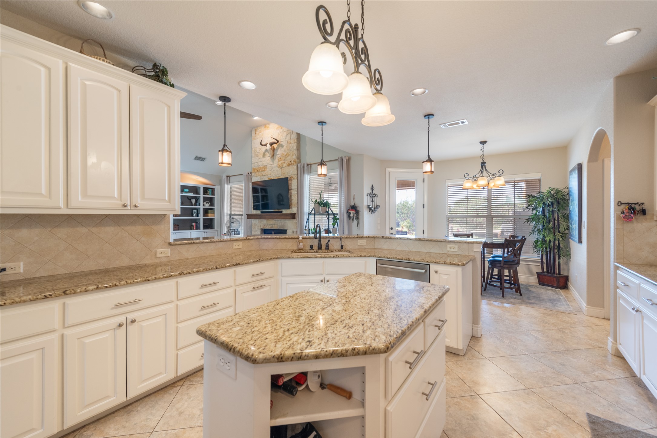 120 Layton Way Georgetown, TX 78633 - Photo 12 of 40 a large kitchen with granite countertop a sink and cabinets
