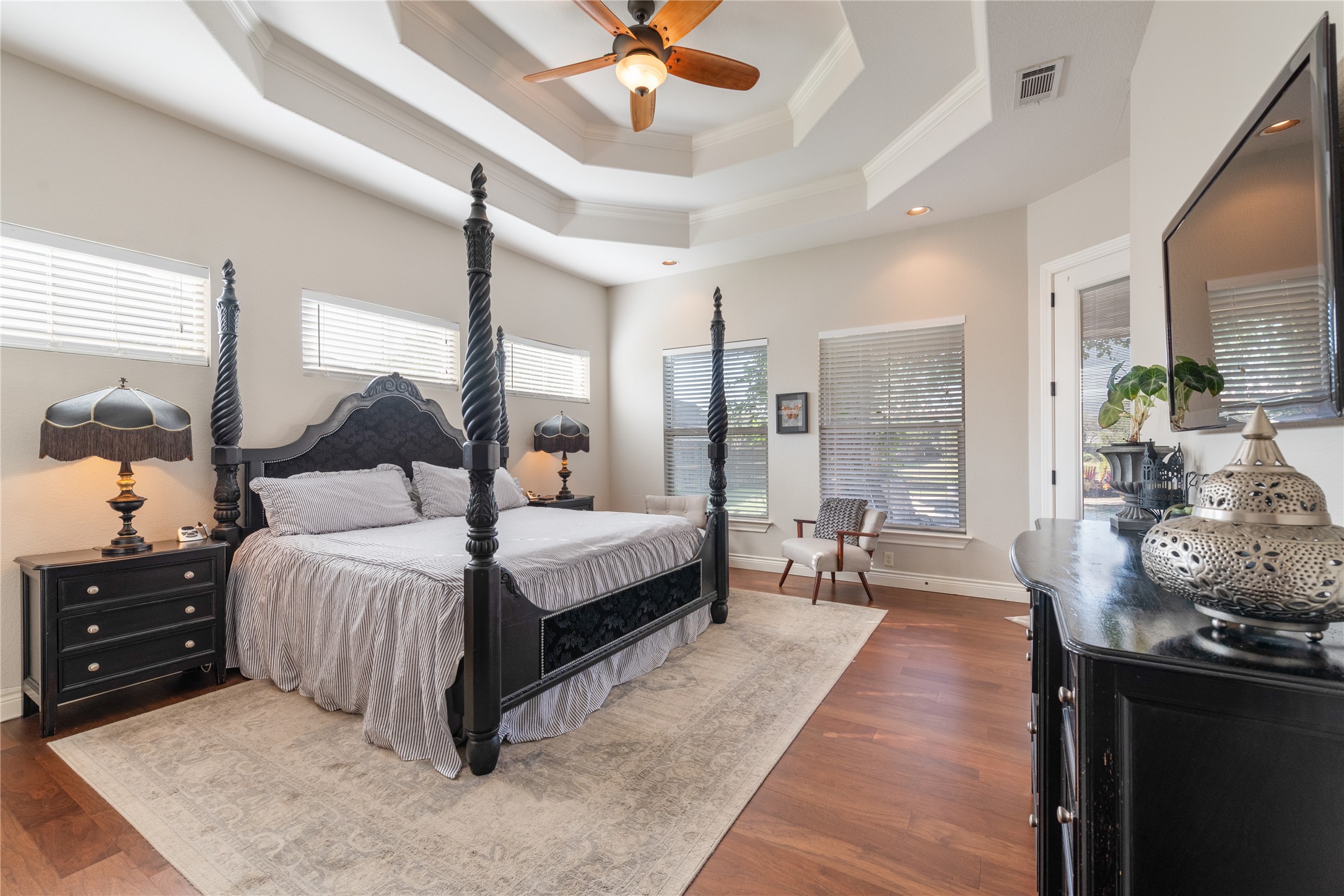 120 Layton Way Georgetown, TX 78633 - Photo 17 of 40 a spacious bedroom with a bed and ceiling fan